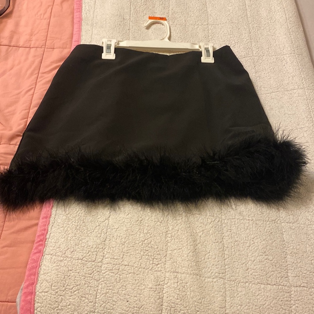 Two piece matching black faux fur skirt and jacket.
